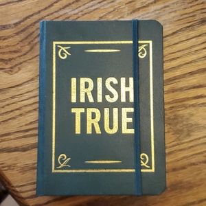 Tullamore Dew Irish whiskey flask in a book